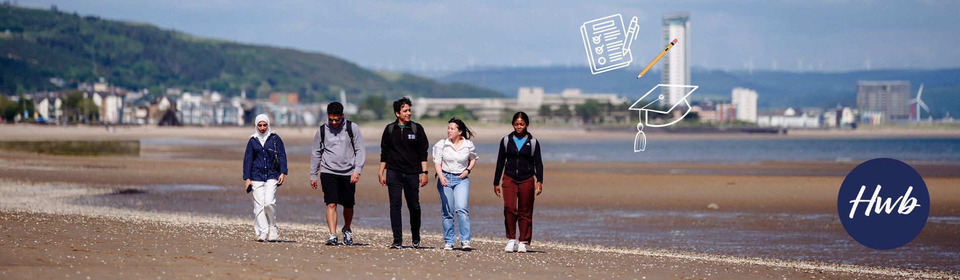 Image of students walking on the beach
