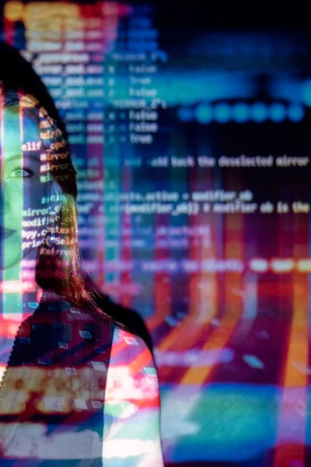 a woman with code being projected onto her face