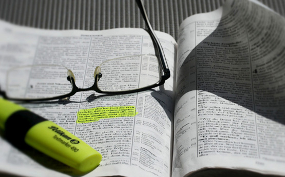 A highlighter and a textbook