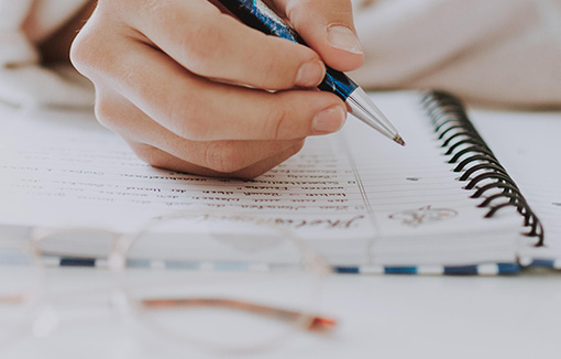 A student writing notes