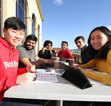 Students sitting outside the Great Hall