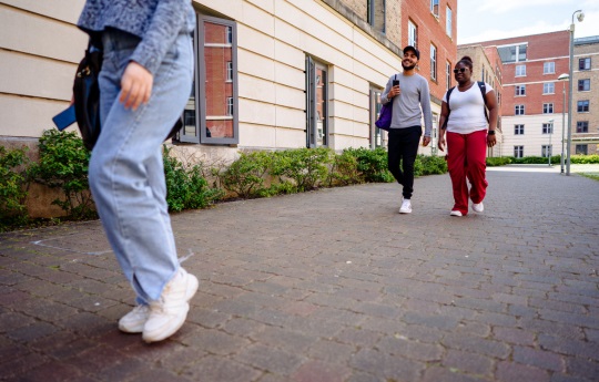 students walking at bay campus in a group