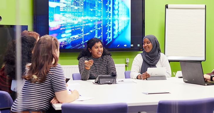 Health Informatics students around table