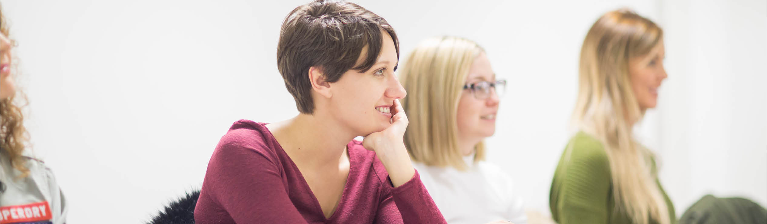 Students in a classroom listening to a discussion