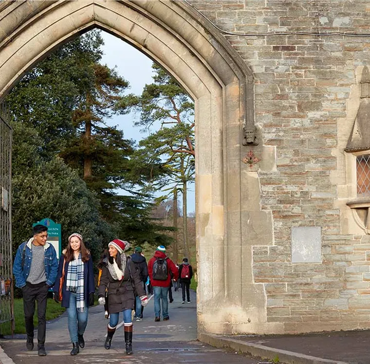 students walking through archway in Singleton Park