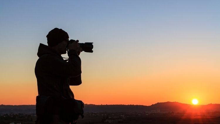 student taking photograph