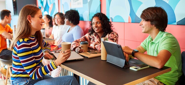 Students sitting at a table at Singelton Campus