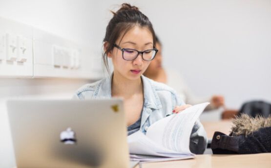 Student using laptop in the library