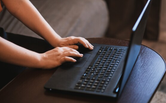 person typing on computer