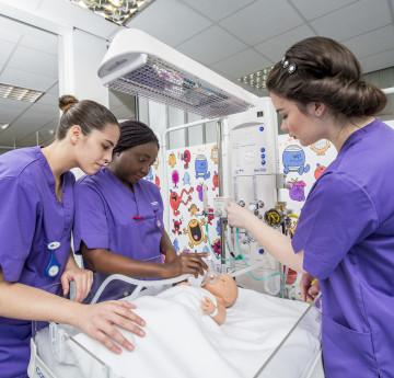 Nursing students in practice suite