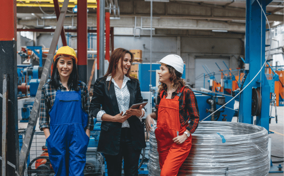 Women working in an industrial setting.